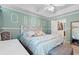 Comfortable main bedroom with decorative molding, tray ceiling, and access to ensuite at 761 Drawbridge Dr., Conway, SC 29526
