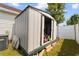 Exterior view of a storage shed with open doors in the backyard at 761 Drawbridge Dr., Conway, SC 29526