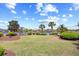 Lush backyard with well-maintained lawn, landscaping, and picturesque water views showcasing serene outdoor living at 8050 Wacobee Dr., Myrtle Beach, SC 29579