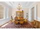 Elegant dining room featuring a chandelier, wainscoting, and a table set for six at 8050 Wacobee Dr., Myrtle Beach, SC 29579