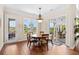 Dining room featuring a round table, four chairs, and sliding door access to outdoor patio at 8050 Wacobee Dr., Myrtle Beach, SC 29579