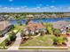 A beautiful home situated on the water features lush landscaping, a well-manicured lawn, and waterfront access at 8050 Wacobee Dr., Myrtle Beach, SC 29579