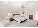 Cozy main bedroom featuring a king size bed, neutral walls, and carpet flooring at 8050 Wacobee Dr., Myrtle Beach, SC 29579