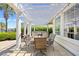 An inviting patio with comfortable seating, a pergola, and string lights offers a relaxing outdoor space at 8050 Wacobee Dr., Myrtle Beach, SC 29579