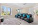Spacious theater room featuring comfortable seating, a plush rug, and large windows at 8050 Wacobee Dr., Myrtle Beach, SC 29579