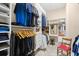 Organized walk-in closet featuring custom shelving, hanging racks, and a vanity with a mirror and comfortable seating at 8050 Wacobee Dr., Myrtle Beach, SC 29579