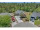 Aerial view of a beautiful home with a well-manicured front yard, complemented by mature trees and a long driveway at 832 Pembridge Ct., Myrtle Beach, SC 29579
