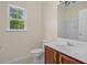 Bright bathroom with a cherry vanity and modern fixtures offers a clean and functional space at 832 Pembridge Ct., Myrtle Beach, SC 29579
