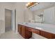 Bathroom featuring large vanity and mirror with doors to walk-in shower and toilet room at 832 Pembridge Ct., Myrtle Beach, SC 29579