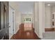 Bright foyer with hardwood floors leads to a living area with large windows for ample natural light at 832 Pembridge Ct., Myrtle Beach, SC 29579