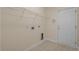 Laundry room with door, storage rack and connections for laundry appliances at 832 Pembridge Ct., Myrtle Beach, SC 29579