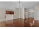 Expansive living room featuring hardwood floors and an elegant chandelier, perfect for entertaining at 832 Pembridge Ct., Myrtle Beach, SC 29579
