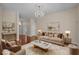 Staged living room featuring plush seating, stylish decor, and ample natural light, creating an inviting atmosphere at 832 Pembridge Ct., Myrtle Beach, SC 29579