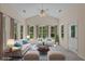 Inviting sunroom with abundant natural light, comfortable seating, and stylish decor, ideal for relaxation at 832 Pembridge Ct., Myrtle Beach, SC 29579