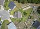 Bird's eye view of a home surrounded by lush greenery, showcasing its backyard, neighborhood, and nearby trees at 853 Derbyshire Ct., Conway, SC 29526
