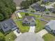 An aerial shot of a charming home with a well-kept lawn, nestled in a friendly neighborhood on a cul-de-sac at 853 Derbyshire Ct., Conway, SC 29526