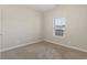 Neutral bedroom with cozy carpet, window providing natural light, and a blank canvas for personalized decor at 853 Derbyshire Ct., Conway, SC 29526