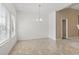 Bright dining room with chandelier and large windows at 853 Derbyshire Ct., Conway, SC 29526