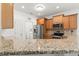 Well-equipped kitchen with stainless steel appliances and wood cabinetry at 853 Derbyshire Ct., Conway, SC 29526