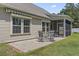 Charming patio with table and chairs, perfect for outdoor enjoyment and relaxation at 853 Derbyshire Ct., Conway, SC 29526