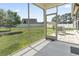 View from screened porch to the patio area and back yard at 853 Derbyshire Ct., Conway, SC 29526