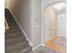 Carpeted stairs with a white wall adjacent to front entryway at 853 Derbyshire Ct., Conway, SC 29526