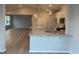Open-concept kitchen with large island, granite countertops, and modern lighting fixtures at 910 Inlet Keys St., Murrells Inlet, SC 29576