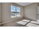 A sunlit bedroom features neutral walls and carpet with a large window at 912 Inlet Keys St., Murrells Inlet, SC 29576