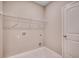 Functional laundry room with shelving and a white marble floor at 912 Inlet Keys St., Murrells Inlet, SC 29576