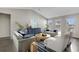 Bright living room with vaulted ceiling, contemporary furnishings, neutral paint and large windows offering abundant natural light at 912 Inlet Keys St., Murrells Inlet, SC 29576