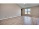 A large living room featuring wood floors and a large window with pond views at 912 Inlet Keys St., Murrells Inlet, SC 29576