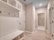Mudroom with built-in storage and wood-look floors, a practical and organized space at 912 Inlet Keys St., Murrells Inlet, SC 29576