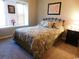 Tranquil bedroom with plush bedding, a large window, and neutral decor at 916 Charles St., North Myrtle Beach, SC 29582