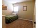 Cozy bedroom featuring a twin bed, natural light, and carpet flooring at 916 Charles St., North Myrtle Beach, SC 29582