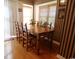 Inviting dining area with hardwood floors, a rustic wood table, and plenty of natural light at 916 Charles St., North Myrtle Beach, SC 29582