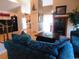 Inviting living room featuring a fireplace, comfortable blue sofas, and hardwood floors at 916 Charles St., North Myrtle Beach, SC 29582