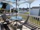 Covered outdoor patio with seating and a table, perfect for relaxing at 916 Charles St., North Myrtle Beach, SC 29582