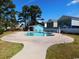 Community pool with sun deck, blue siding building, and manicured lawn, offering residents a refreshing outdoor space at 916 Charles St., North Myrtle Beach, SC 29582