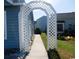 Walkway leading to the home with decorative trellis and landscaping at 916 Charles St., North Myrtle Beach, SC 29582