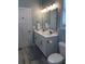 Bright bathroom featuring a double sink vanity with white cabinets and light countertops at 928 Strand Ave. Strand Ave., North Myrtle Beach, SC 29582