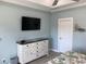 Bedroom featuring a modern dresser with a TV, providing comfort and convenience at 928 Strand Ave. Strand Ave., North Myrtle Beach, SC 29582
