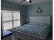 Serene bedroom with a full bed, large window with blinds, and a starfish themed wreath at 928 Strand Ave. Strand Ave., North Myrtle Beach, SC 29582