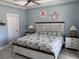 Comfortable bedroom with a king-size bed, bedside tables, and nautical decor, designed for relaxation at 928 Strand Ave. Strand Ave., North Myrtle Beach, SC 29582