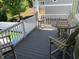 View of the cozy deck, featuring gray composite planks, white railings and outdoor dining furniture at 928 Strand Ave. Strand Ave., North Myrtle Beach, SC 29582