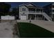 Charming two-story home with a garage, beautiful landscaping, and a welcoming second-story porch at 928 Strand Ave. Strand Ave., North Myrtle Beach, SC 29582
