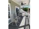 Relaxing covered porch with rocking chairs and outdoor seating, offering a tranquil space to enjoy the surroundings at 928 Strand Ave. Strand Ave., North Myrtle Beach, SC 29582
