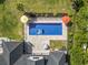 Aerial view of the backyard pool with an umbrella and lounge seating at 9449 Freewoods Rd., Myrtle Beach, SC 29588