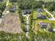 Birds-eye view of homes and neighborhood featuring long driveway and mature tree line at 9449 Freewoods Rd., Myrtle Beach, SC 29588