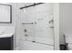Elegant bathroom featuring a marble tiled shower and luxurious soaking tub at 9449 Freewoods Rd., Myrtle Beach, SC 29588