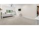Bright bedroom with plush carpet, ceiling fan, and sunny window with blinds at 9449 Freewoods Rd., Myrtle Beach, SC 29588
